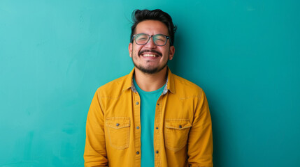 Wall Mural - A man in a yellow shirt is smiling and wearing glasses