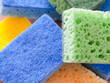 Vibrant Scrub Sponges. Brightly colored sponges with a focus on texture. Uses for Online retail, cleaning tutorials.