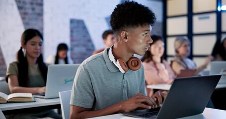 Poster - Male student, laptop and attention with typing in classroom for online, learning and development. African man, tech and people for education in group, exam or project at school, university or college
