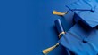© lemoncraft - Sophisticated blue graduation cap and diploma setup, representing educational success and commencement milestones
