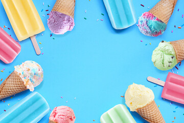 Poster - Collection of colorful pastel ice cream cones and popsicle summer frozen desserts. Top view frame on a blue background. Copy space.