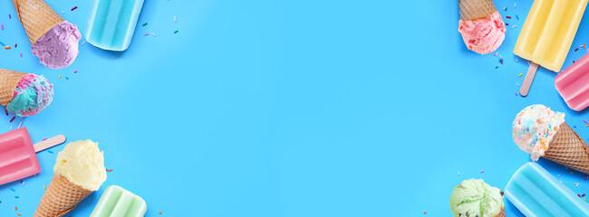 Poster - Variety of colorful pastel ice cream cones and popsicle summer frozen desserts. Top down view double border on a blue banner background. Copy space.