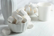 White marshmallows on a wooden table.