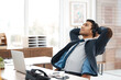 © peopleimages.com - Headset, man and relax for rest in office with customer service, tech and web support. Male agent, headphones and target complete with laptop at call center for client advice, consulting and telecom