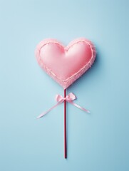 Wall Mural - pink heart-shaped cushion on blue background