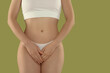 © New Africa - Gynecology. Woman in underwear on green background, closeup. Space for text