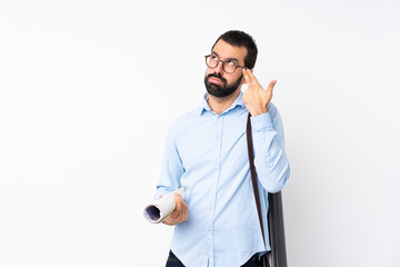 Wall Mural - Young architect man with beard over isolated white background with problems making suicide gesture