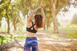 Stretch, back and woman in park for exercise with health, sport training and running in nature. Fitness, workout and girl athlete outdoor with strong body for energy, wellness and cardio in Colombia