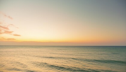 Wall Mural - clear blue sky sunset with glowing orange teal color horizon on calm ocean seascape background picturesque generative ai