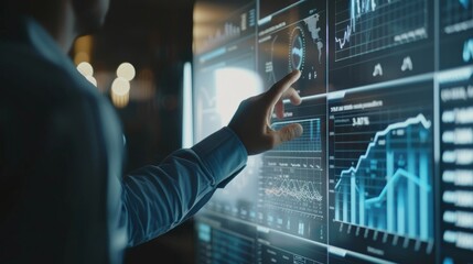 Businessman is touching a virtual screen displaying business data and analytics on a digital display, showcasing advanced financial software for representing company performance.