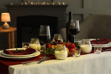 Canvas Print - Stylish table setting with burning candles and wine indoors. Romantic dinner