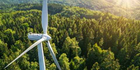 Wall Mural - Close up of white wind turbine with lush forest trees in the background, copy space.