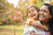 © Prasanth - Happy indian mother having fun with her daughter outdoor - Family people and love concept - Focus on mum face