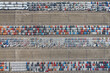 Aerial view of new cars parked for sale in a stock lot row