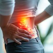 © bteeranan - Closeup of an individual holding their stomach with red pain areas highlighted, symbolizing treatment for sciatica or peafciao specifically focused on the torso and hand with a blurred background.