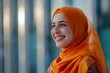 smiling muslim woman in vibrant orange hijab portrait radiating happiness and positivity diversity photograph