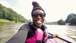 Joyful African-American woman makes selfie rafting on wide calm river closeup