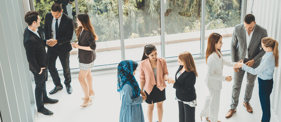 Many business people gathering in modern office building for business conference in the city. Businessmen and businesswomen communication and human resources concept. uds