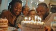 © Sasint - A mixed-race family celebrating a birthday party at home