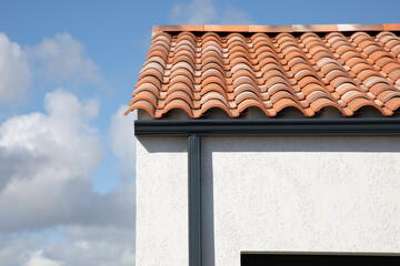 Wall Mural - aluminum grey gutter on modern roof of the building and gray downpipe on facade wall home