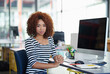 African woman, portrait and business at desk in office for work, computer and online company. Female person, creator and creative designer at workplace for web developer, website and coding.