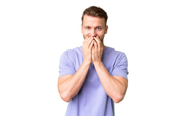 Wall Mural - Young handsome caucasian man over isolated chroma key background happy and smiling covering mouth with hands