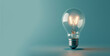 © Duka Mer - A light bulb, shining on a blue background, vintage modernism, eco-friendly craftsmanship, clever wit, and colors of light cyan and gray.