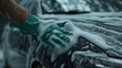 Care and Precision: Person Hand Washing Car with Foam and Sponge, Automotive Maintenance and Detailing Concept