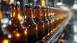 Industrial beer bottling line in a brewery with amber bottles