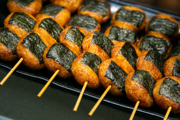 Wall Mural - Yaki Onigiri are Japanese rice balls that are pan-grilled and glazed in savory soy sauce. 