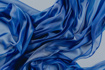 Majestic blue satin fabric with ripples creates a mesmerizing and luxurious texture.