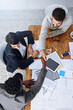 © peopleimages.com - Above, business people and handshake after meeting or presentation, blueprint and ideas in office. Architecture, audience and speaker with thank you, company pitch and clients attention in workplace