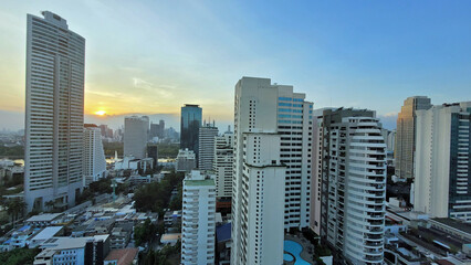 Wall Mural - sunset hours in bangkok with skyscrapers