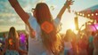 © Varunee - Attractive young beautiful woman dancing at a music festival party.