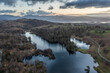 Beautiful, aerial drone landscape image of Lake District during Spring vibrant sunset