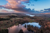 Fototapeta Londyn - Beautiful, aerial drone landscape image of Lake District during Spring vibrant sunset