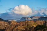 Fototapeta Londyn - Beautiful Spring landscape image in Lake District looking towards Langdale Pikes during colorful sunset