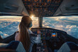 © Ekaterina Shvaygert - Woman pilot wearing headset is sitting in airplane cockpit