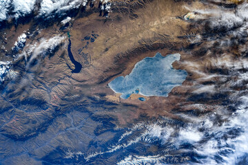 Wall Mural - frozen lake in the area of madoi county, china. digital enhancement of an image by nasa