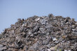 A pile of scrap metal is on top of a hill