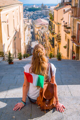 Wall Mural - Tourist woman with bag and flag in Sicilia, Caltagirone- Italy