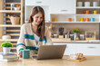 © Art_Photo - Young smiling asian woman relax using laptop conference work,learning education,study online,webinar podcast,creative woman looking at screen, shopping, online marketing at home