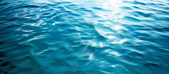 Wall Mural - clear blue sea water surface with light reflections texture