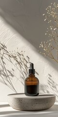 Canvas Print - Close-up of a dropper bottle on a textured surface with a plant in the background