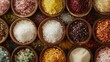 A colorful assortment of gourmet salts, raw sugars, and dried chili peppers, offering a selection of premium ingredients for culinary enthusiasts.