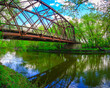 Historical railroad bridge over Big Sioux River converted into pedestrian footpath and bike trail in the Sioux Falls City Green Space Conservation Park, South Dakota