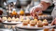 © WMSTUDIO - A chef is preparing a dessert platter with a variety of pastries