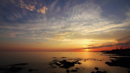 Wall Mural - landscape with sunset sun and clouds over sea, time lapse 4k