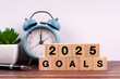 2025 goals text and number engraved on wood block