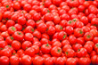 Heap of fresh red tomatoes at a street market